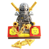MinifigurePacks: Lego Ninjago Bundle (1) Zane Minifigure - Titanium Variant (1) Figure Display Base (4) Figure Accessory's (Shamshir Swords - Throwing Stars (Shuriken) - Nunchucks)