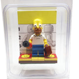 MinifigurePacks: Lego Simpsons Bundle (1) Homer Simpson Minifigure (1) Figure Display Base (2) Figure Accessory's (Buzz Soda Can - Briefcase)